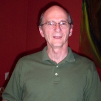 Wayne Fisher Balding man wearing glasses